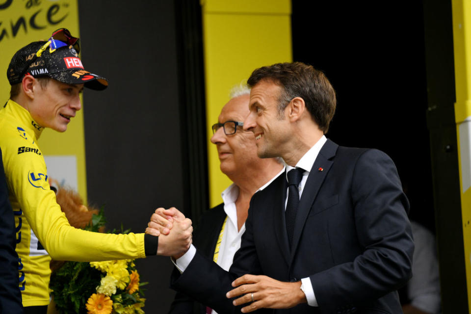 CAUTERETSCAMBASQUE FRANCE  JULY 06 LR Jonas Vingegaard of Denmark and Team JumboVisma  Yellow Leader Jersey congratulated by Emmanuel Macron of France President of France on the podium ceremony after the stage six of the 110th Tour de France 2023 a 1449km stage from Tarbes to CauteretsCambasque 1355m  UCIWT  on July 06 2023 in  CauteretsCambasque France Photo by David RamosGetty Images