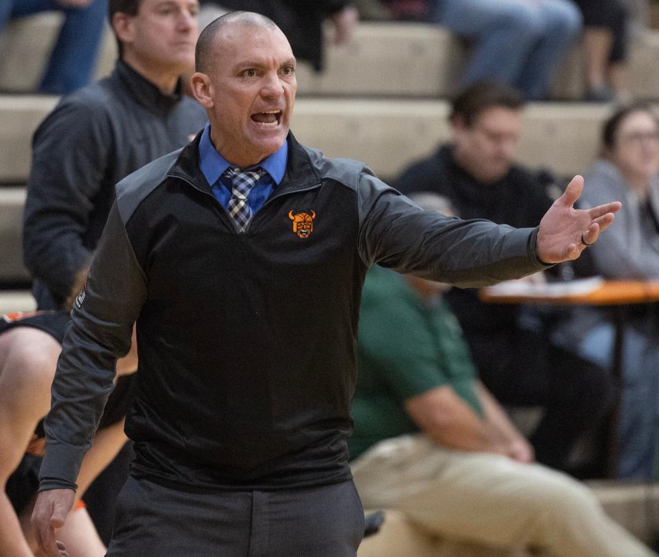 Hoover head coach Mike Bluey gestures to the court vs. Hoban in the Hall of Fame City Hardwood Classic at Washington High School, Saturday, Dec. 16. 2023.