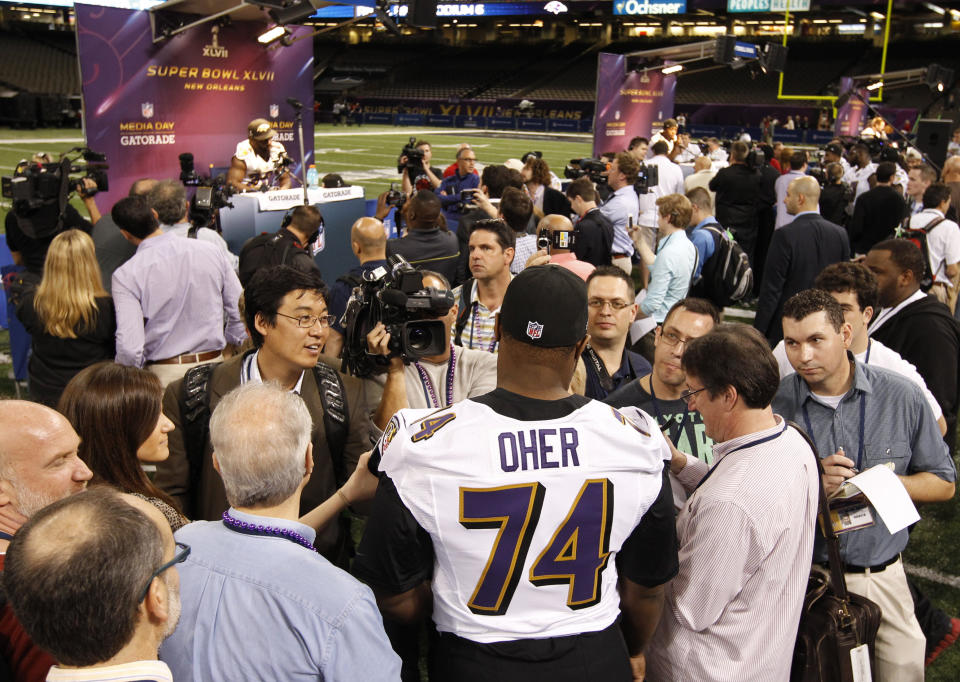 Baltimore Ravens tackle Michael Oher (74) is interviewed by reporters during Media Day for the NFL's Super Bowl XLVII in New Orleans, Louisiana January 29, 2013. The San Francisco 49ers will meet the Ravens in the game on February 3. REUTERS/Jeff Haynes (UNITED STATES - Tags: SPORT FOOTBALL) 