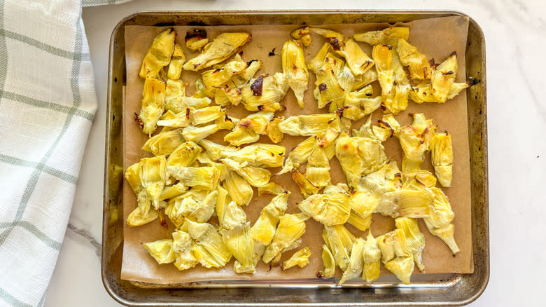baking sheet with cooked artichokes