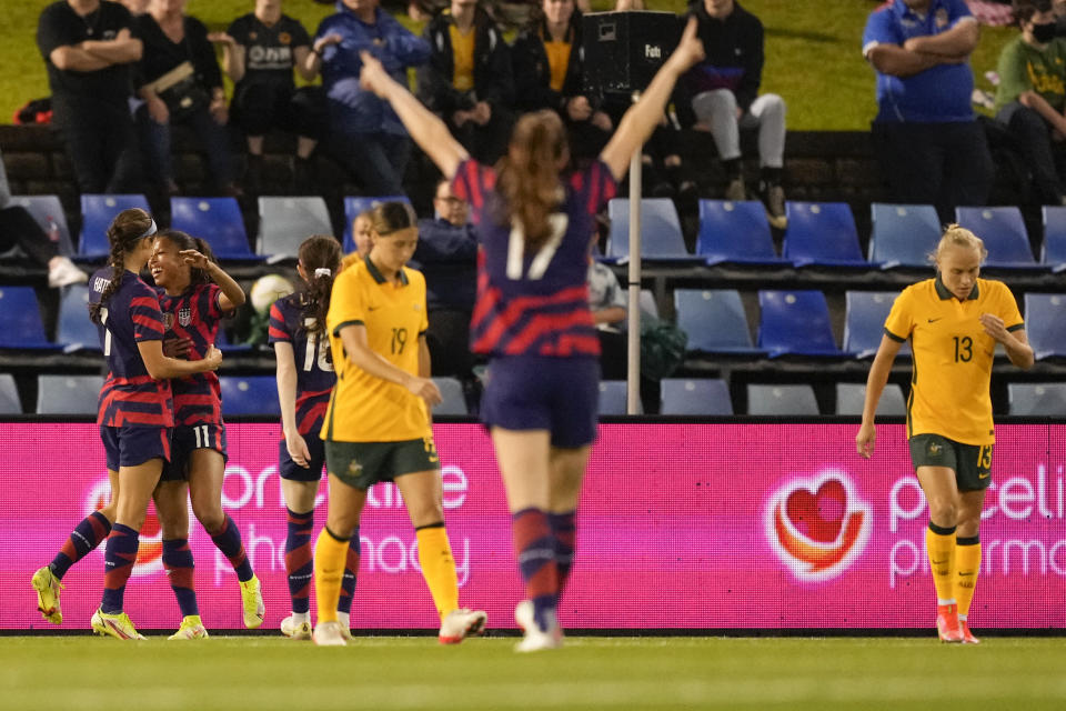 United States' Margaret Purce, second left, is congratulated by teammates after scoring her team's first goal during the international women's soccer match between the United States and Australia in Newcastle, Australia, Tuesday, Nov. 30, 2021. (AP Photo/Mark Baker)