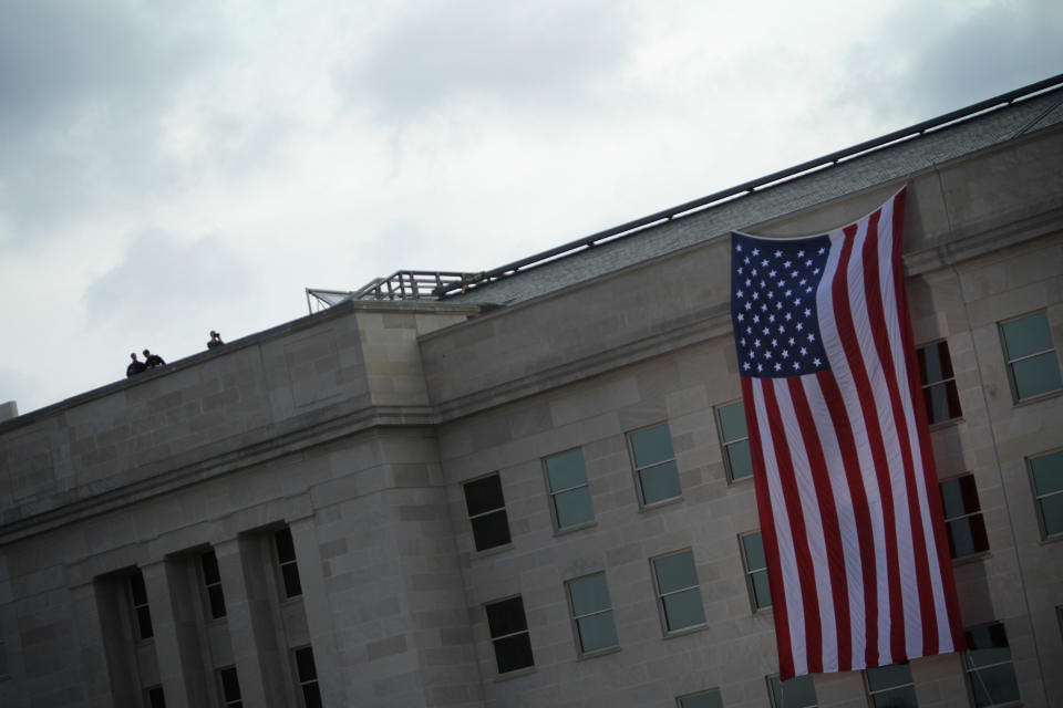 ARLINGTON, VA - SEPTEMBER 11:  Security personnel observe on the roof of the Pentagon prior to a ceremony to mark the 13th anniversary of the 9/11 terrorists attacks at the Pentagon Memorial September 11, 2014 in front of the Pentagon in Arlington, Virginia. This year marks the 13th anniversary of the September 11th terrorist attacks that killed nearly 3,000 people at the World Trade Center, Pentagon and on Flight 93.  (Photo by Alex Wong/Getty Images)