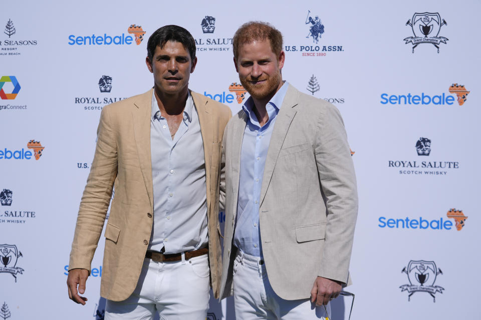 Britain's Prince Harry, right, poses with Argentine professional polo player Ignacio "Nacho" Figueras, as he arrives for the 2024 Royal Salute Polo Challenge to Benefit Sentebale, Friday, April 12, 2024, in Wellington, Fla. Prince Harry, co-founding patron of the Sentebale charity, will play on the Royal Salute Sentebale Team. (AP Photo/Rebecca Blackwell)