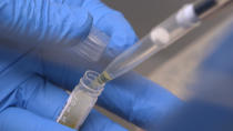 In this Nov. 20, 2019 image from video, National Institute of Health researchers test patient samples in Bethesda, Md. The NIH has more than doubled funding -- to more than $14 million -- for scientists around the country to unravel the biology of ME/CFS, also known as chronic fatigue syndrome, since 2015, when the influential Institute of Medicine decried “a paucity of research.” (AP Photo/Federica Narancio)