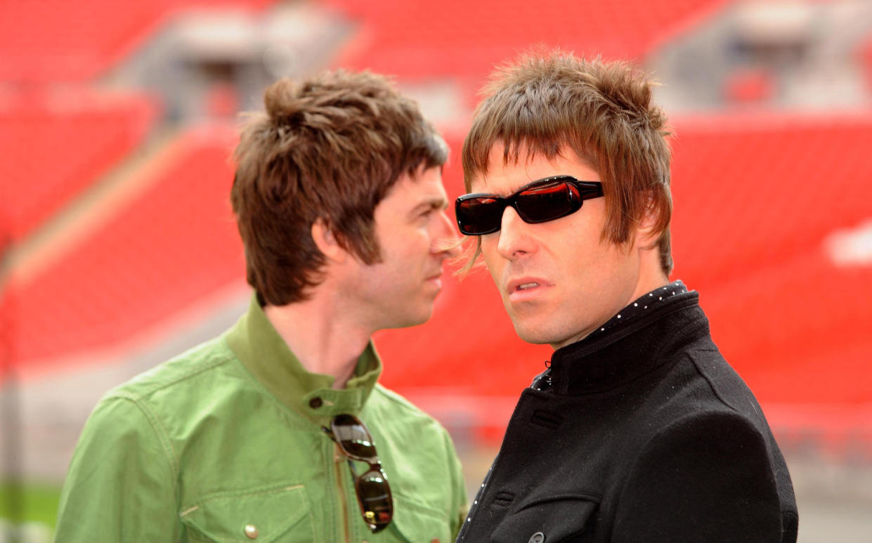 Oasis band members Noel Gallagher and Liam Gallagher are pictured during a photocall at Wembley Stadium, where they announced their biggest ever tour of open air venues in the UK and Ireland next summer.