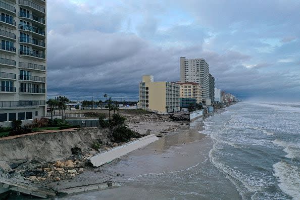 In this aerial view, seawalls along condo buildings are shown breached by Hurricane Nicole on November 10, 2022, in Daytona Beach, Florida. The storm surge associated with Nicole coincided with already-high tides caused by this week's full moon, putting more stress on aging sea walls meant to protect coastal communities.