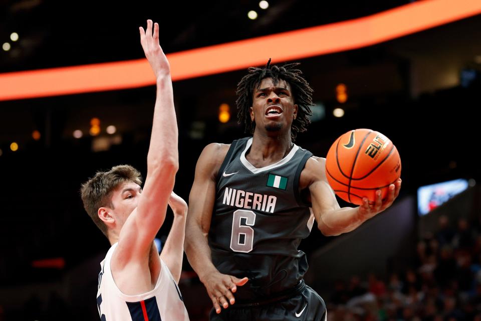 PORTLAND, OREGON - APRIL 08: MacKenzie Mgbako #6 of World Team shoots against Kyle Filipowski #5 of USA Team in the third quarter during the Nike Hoop Summit at Moda Center on April 08, 2022 in Portland, Oregon.