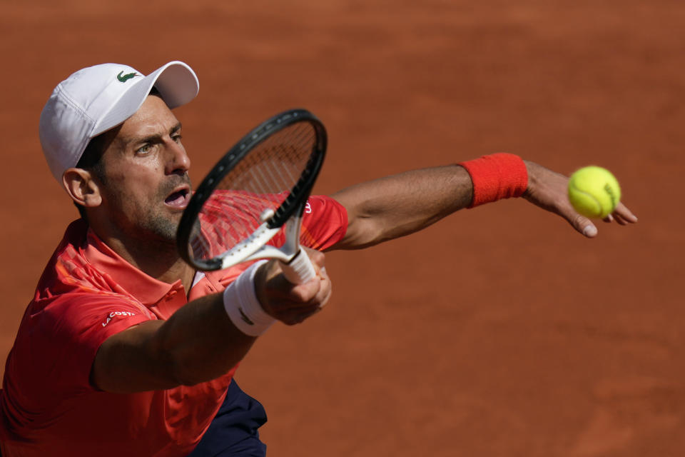 Serbia's Novak Djokovic plays a shot against Russia's Karen Khachanov during their quarter final match of the French Open tennis tournament at the Roland Garros stadium in Paris, Tuesday, June 6, 2023. (AP Photo/Thibault Camus)