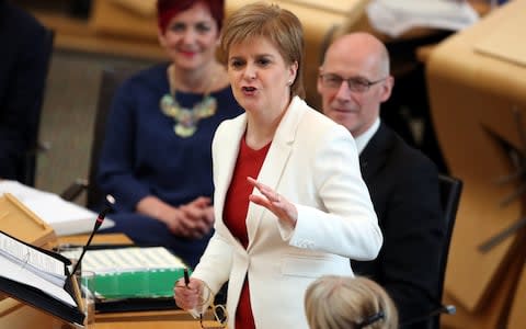 First Minister Nicola Sturgeon during First Minister's Questions at the Scottish Parliament in Edinburgh - Credit: PA