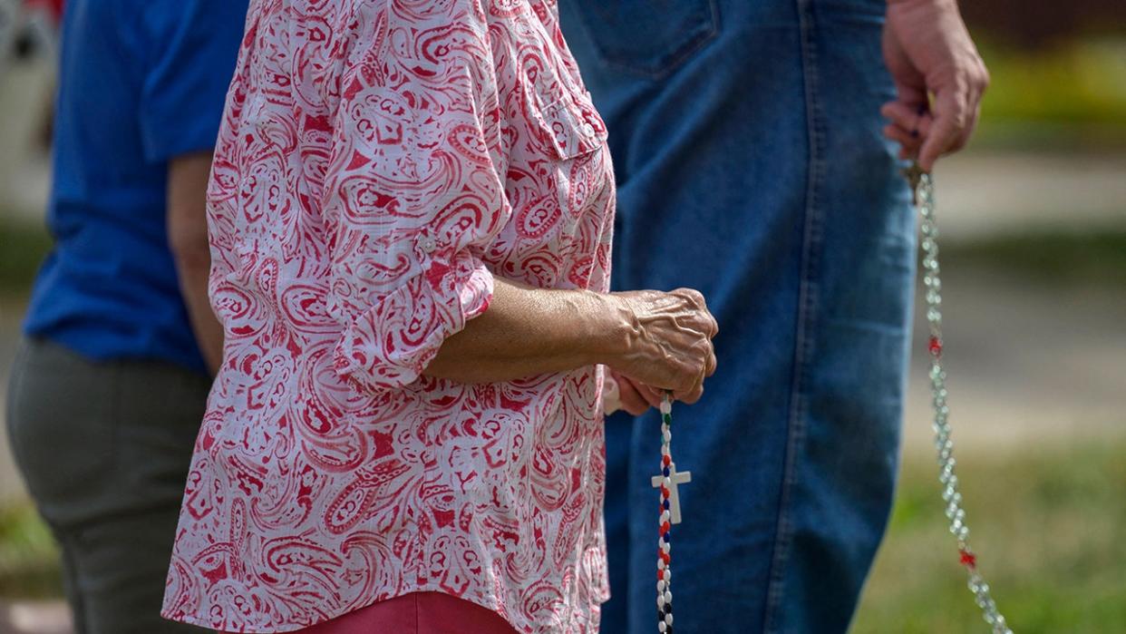 Elderly woman praying