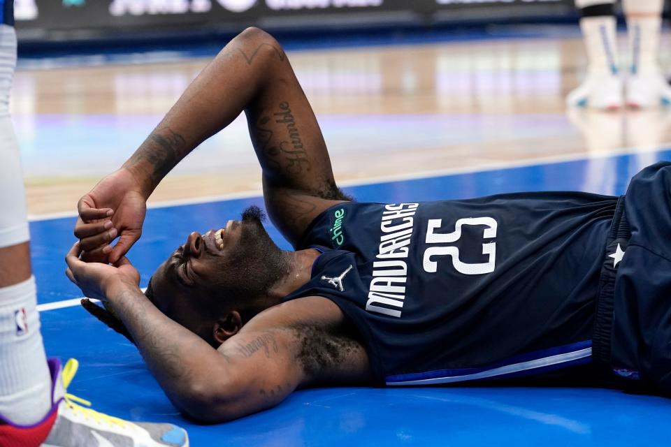 Dallas Mavericks forward Reggie Bullock (25) reacts after being called for a foul during the second half against the Golden State Warriors in Game 3 of the NBA basketball playoffs Western Conference finals, Sunday, May 22, 2022, in Dallas. (AP Photo/Tony Gutierrez)