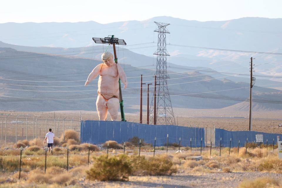 A 43-foot-tall naked statue resembling Donald Trump is displayed in a fenced-in lot near Interstate 15 north of Las Vegas, Nevada, September 28, 2024. (AFP via Getty Images)