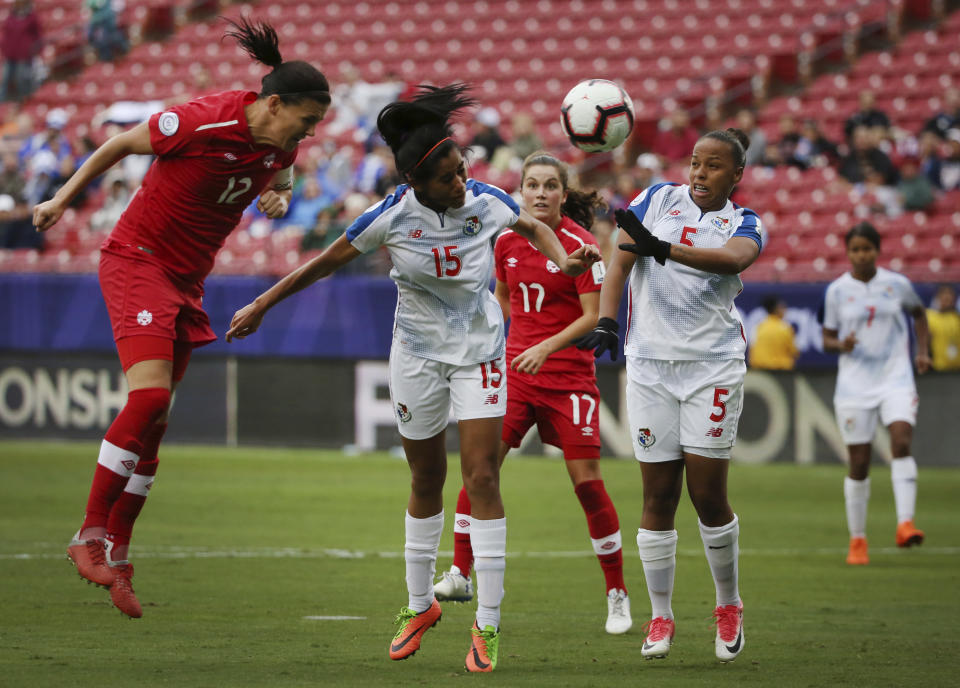 Panama defender Rebeca Espinosa (15) and defender Yomira Pinzon (5) attempt to defend against Canada forward Christine Sinclair (12) as Sinclair scores a goal during the second half of a soccer match at the CONCACAF women's World Cup qualifying tournament in Frisco, Texas, Sunday, Oct. 14, 2018. (AP Photo/Andy Jacobsohn)