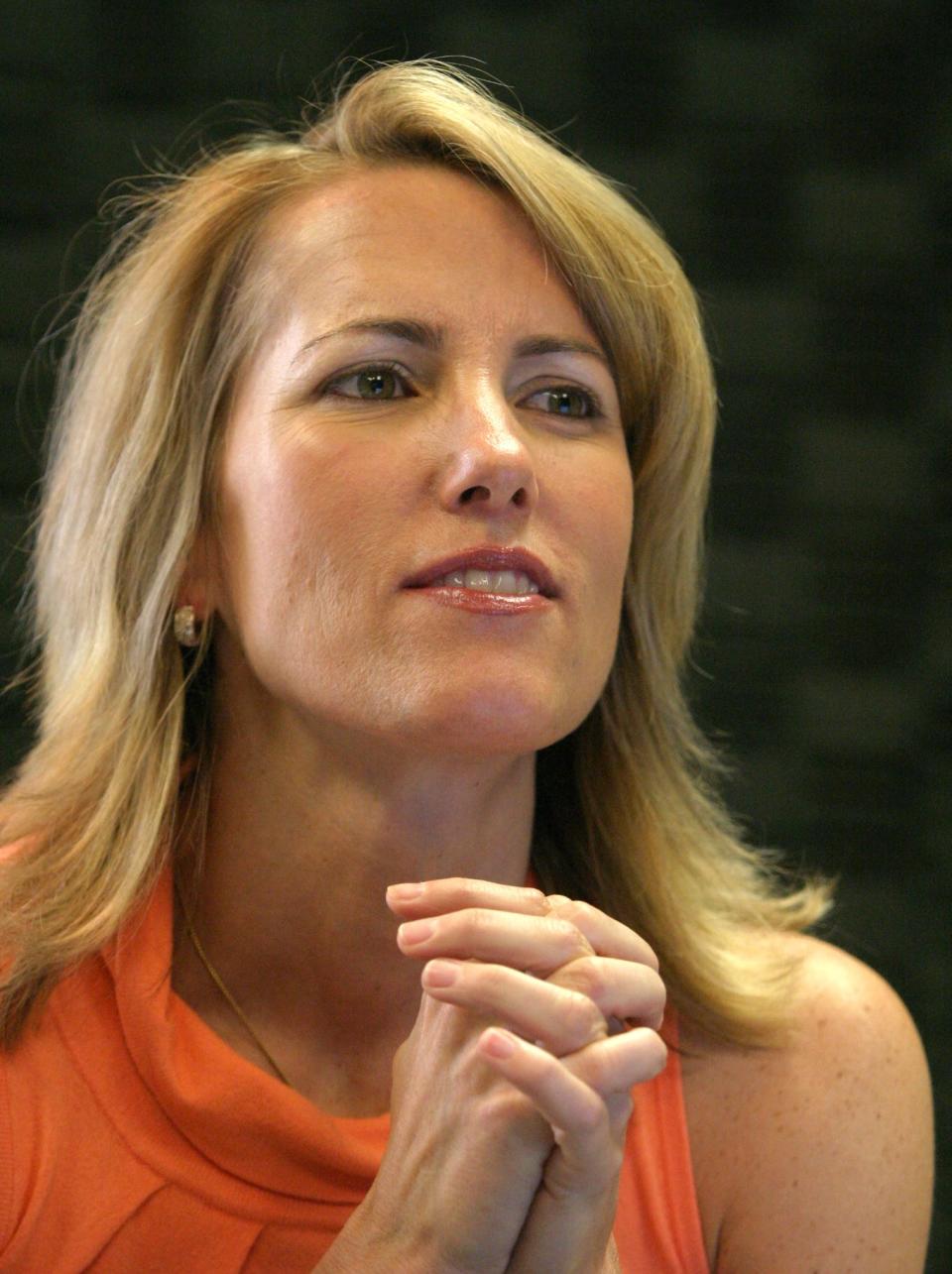 Laura Ingraham in her studio after the Laura Ingraham Show, as she talks with her producers who are off camera.