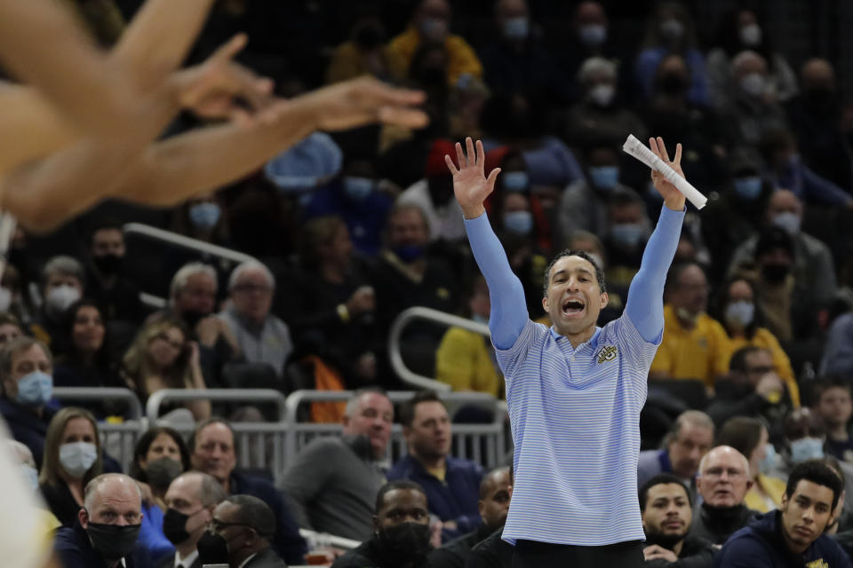 FILE - Marquette coach Shaka Smart yells from the sideline during the first half of the team's NCAA college basketball game against Seton Hall on Jan. 15, 2022, in Milwaukee. Marquette wants to build on the strides it made last year in Smart’s debut season. The Golden Eagles went 19-13 and reached the NCAA Tournament last season, a marked improvement from their 13-14 performance in 2020-21. (AP Photo/Aaron Gash, File)