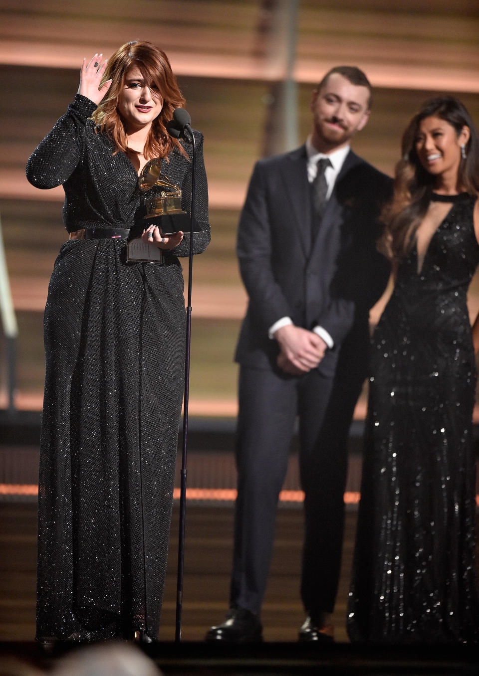 LOS ANGELES, CA - FEBRUARY 15:  Singer Meghan Trainor (L) accepts the Best New Artist award from singer Sam Smith onstage during The 58th GRAMMY Awards at Staples Center on February 15, 2016 in Los Angeles, California.  (Photo by Kevork Djansezian/Getty Images for NARAS)