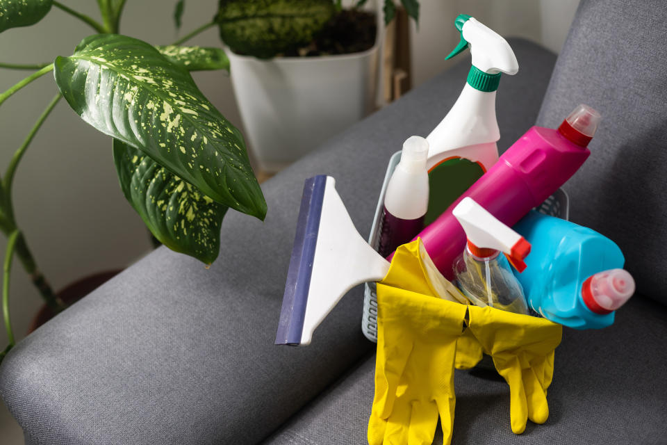 Cleaning supplies on top of a couch