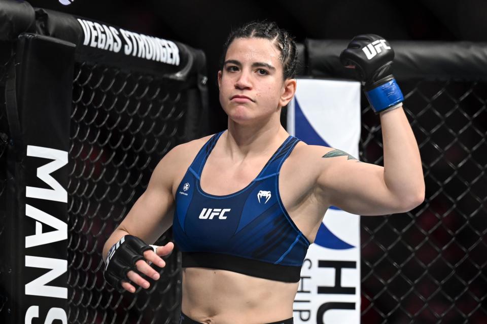 Sep 3, 2022; Paris, FRANCE; Ailin Perez (blue gloves) is introduced for the fight against Stephanie Egger (not pictured) during UFC Fight Night at Accor Arena. Mandatory Credit: Per Haljestam-USA TODAY Sports