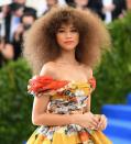 <p>Zendaya was the belle of the ball with her teased-out Afro, bronze makeup, and coral-red lipstick. (Photo: Getty Images) </p>