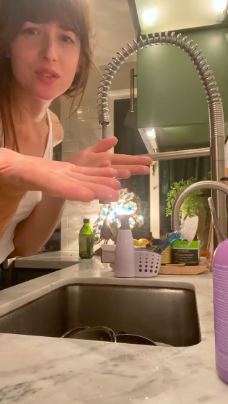 <p>Dakota Johnson has shown her fans exactly how she washes her hands at home during Covid-19.</p><p>In a <a href="https://www.instagram.com/p/B-NYycoHcIf/" rel="nofollow noopener" target="_blank" data-ylk="slk:video;elm:context_link;itc:0;sec:content-canvas" class="link ">video</a> shared on actress Olivia Wilde's Instagram account, the 50 Shades of Grey star thanks the mother-of-two for asking her how she washes her hands and proceeds to clean 'them' at her kitchen sink.</p><p>'Dakota Johnson: Hand wash CHAMPION,' the actress captioned the video which sees Johnson's partner Chris Martin washing his hands to give the impression that they are, in fact, his girlfriend's. In the clip, the Coldplay frontman can't be seen on camera but we're pretty sure it's him given the 'A' tattoo on the person in question's left wrist. After all, the singer has the exact same inking. </p><p>In the clip, the actress washes 'her' hands thoroughly with a scrubbing brush and even washes her hair to give it a deep clean.</p><p>We could watch this video all day long. </p>