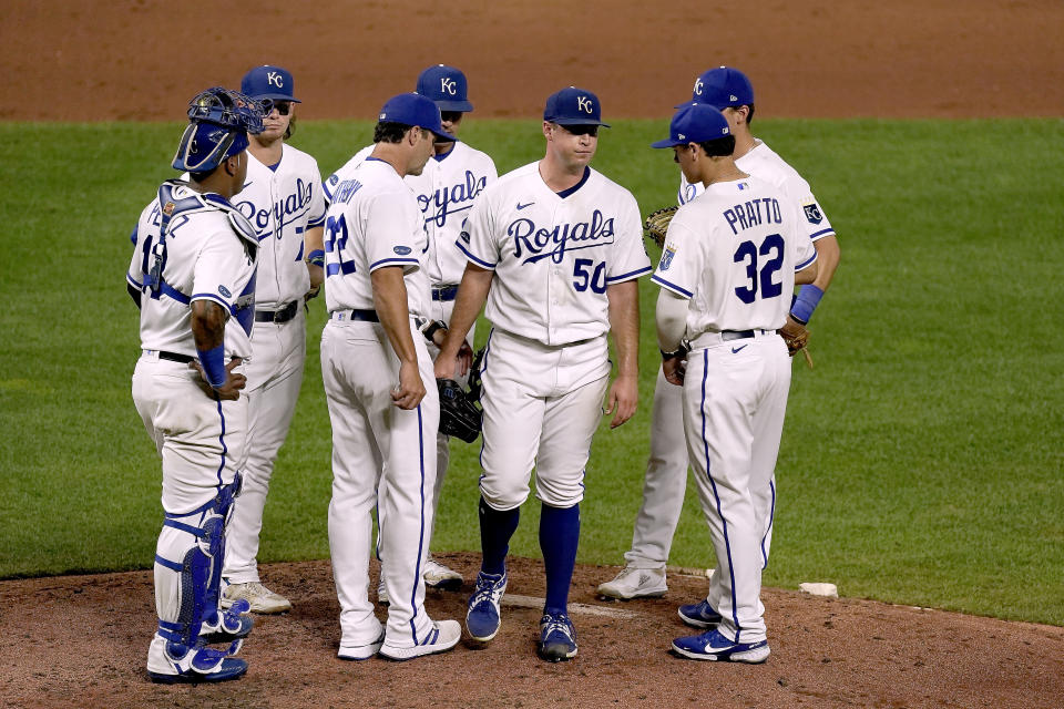 Kansas City Royals starting pitcher Kris Bubic walks to the dugout after coming out of the game during the sixth inning of a baseball game against the Chicago White Sox Wednesday, Aug. 10, 2022, in Kansas City, Mo. (AP Photo/Charlie Riedel)
