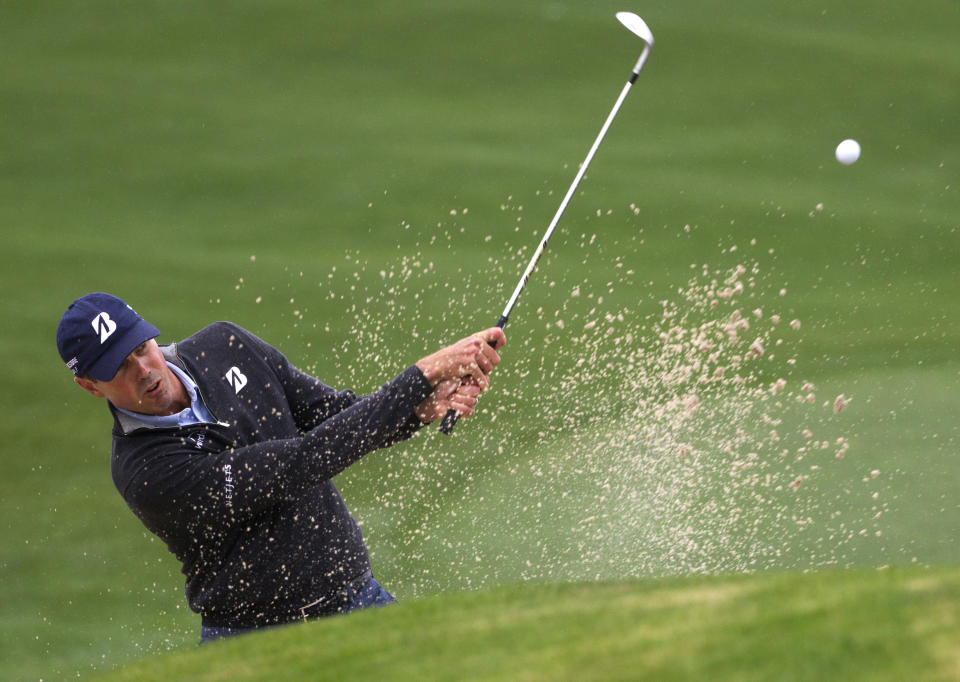 Matt Kuchar takes shot out of the bunker on the 18th green during a playoff hole against Matt Jones in the final round of the Houston Open golf tournament, Sunday, April 6, 2014, in Humble, Texas. Matt Jones won the playoff to become the Houston Open champion. (AP Photo/Patric Schneider)