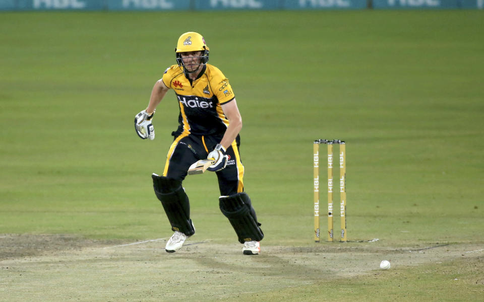 Peshawar Zalmi' Tom Kohler-Cadmore take a score during a Pakistan Super League T20 cricket match between Islamabad United and Peshawar Zalmi at the National Stadium, in Karachi, Pakistan, Saturday, Feb. 27, 2021. (AP Photo/Fareed Khan)