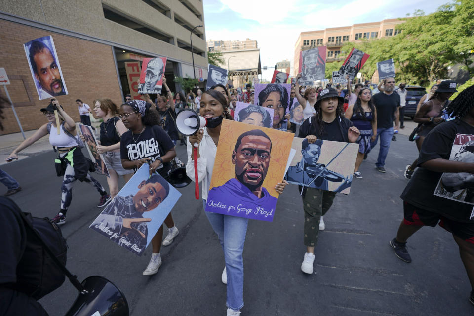 FILE - A small group of protesters marches after former Minneapolis police officer Derek Chauvin was sentenced to 22.5 years in prison for the murder of George Floyd, on June 25, 2021, in downtown Minneapolis. The Minneapolis City Council is set to hold a special meeting Thursday to discuss a potential settlement in a lawsuit filed by the Minnesota Department of Human Rights over the city’s policing practices following the murder of George Floyd. (AP Photo/Julio Cortez File)