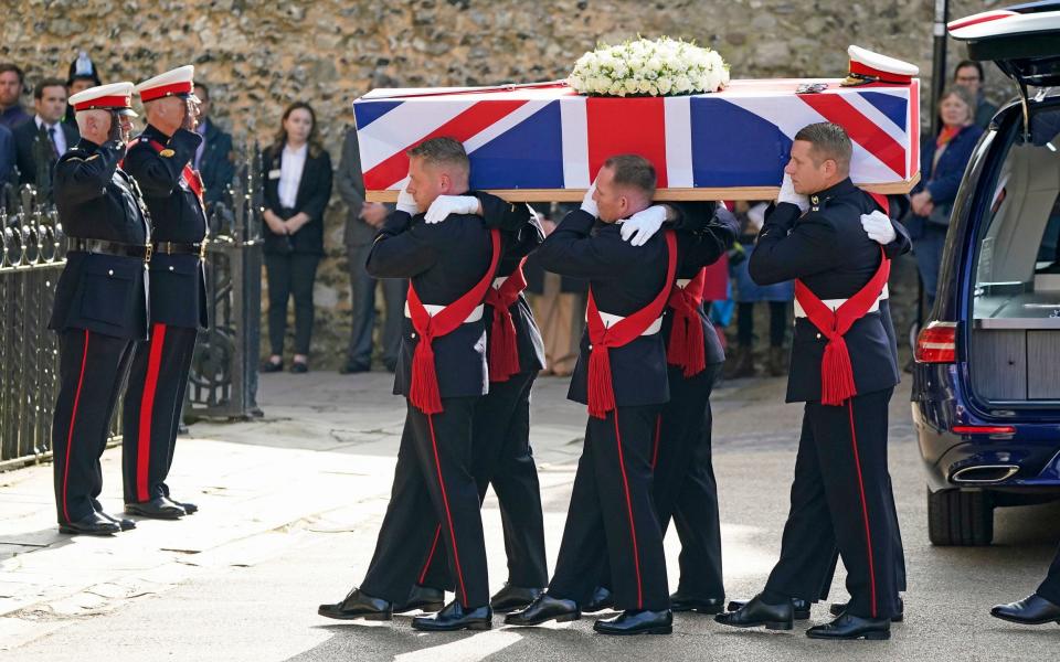 Pallbearers carry Maj Gen Holmes’s coffin into Winchester Cathedral in October 2021 - Andrew Matthews/PA