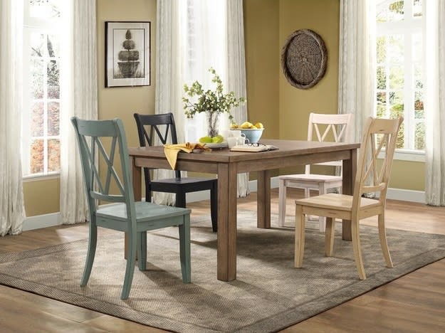 Home with different color chairs at table