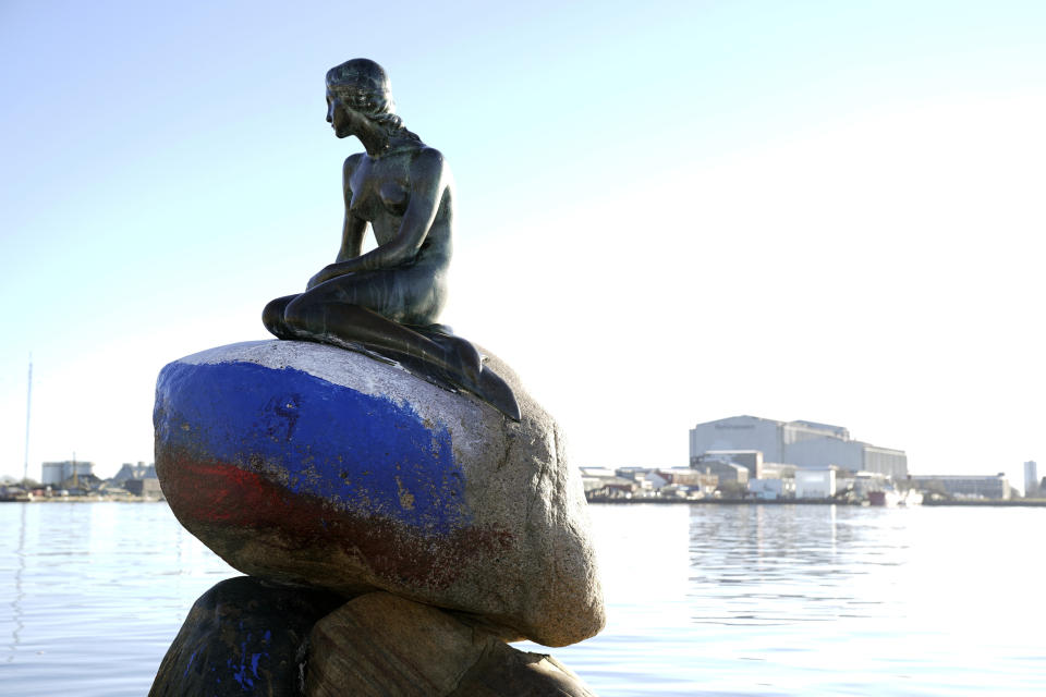 The Russian flag is painted on the stone where the Little Mermaid sits on, after the sculpture was vandalized, in Copenhagen, Denmark, Thursday, March 2, 2023. (Ida Marie Odgaard/Ritzau Scanpix via AP)