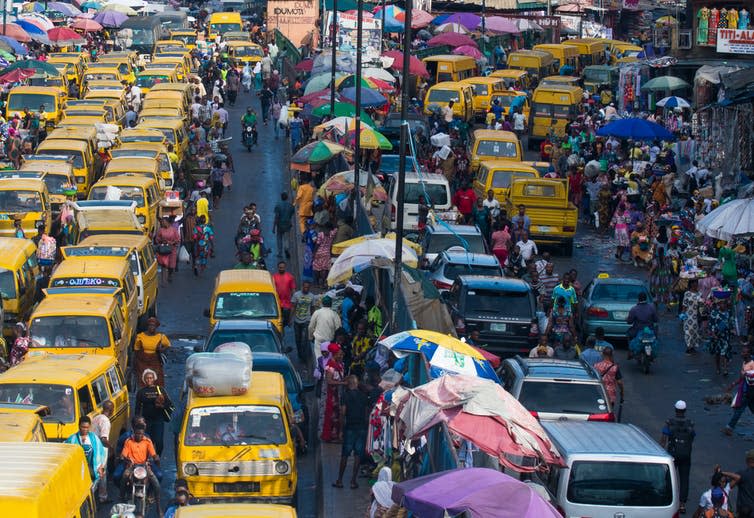 Yellow minibuses on a busy street