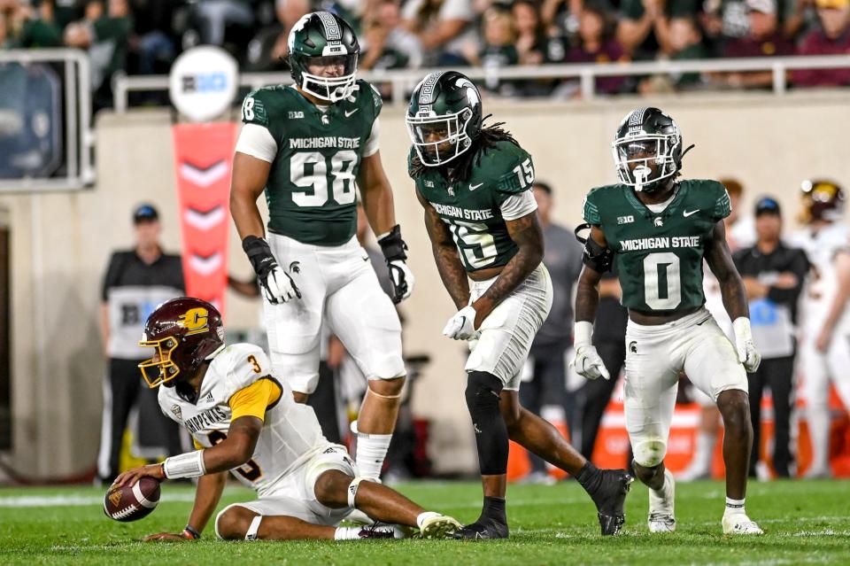 Michigan State's Angelo Grose, center, celebrates after sacking Central Michigan's Bert Emanuel, Jr. during the third quarter on Friday, Sept. 1, 2023, at Spartan Stadium in East Lansing.