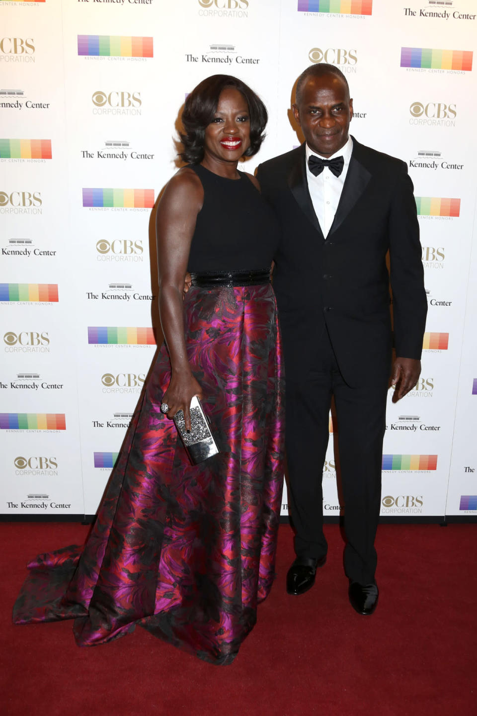 Viola Davis in a hot pink floral skirt with Julius Tennon at the 38th Annual Kennedy Center Honors at The Kennedy Center Hall of States in Washington, DC.