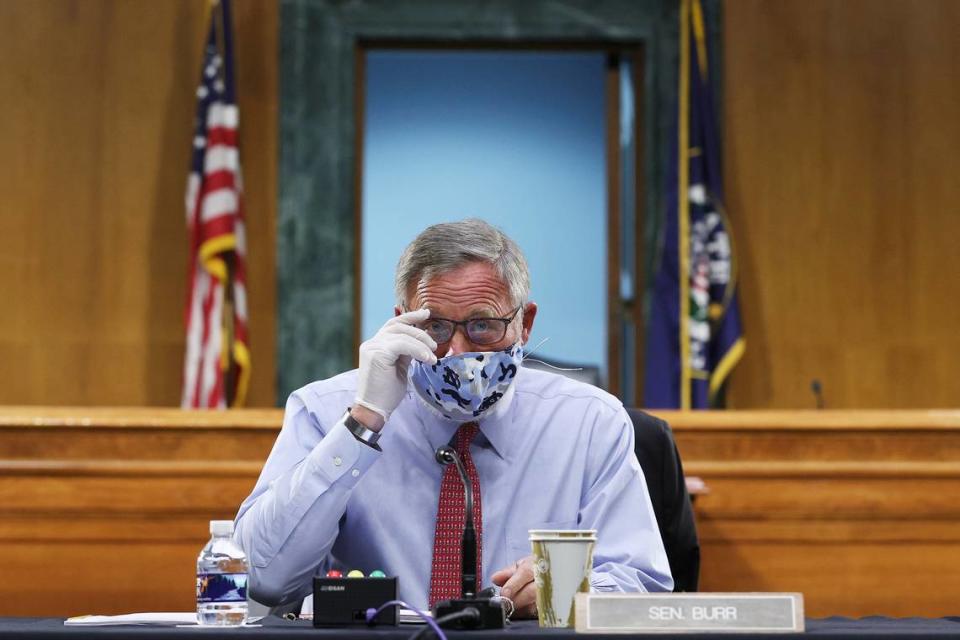 Sen. Richard Burr, R-N.C., arrives at a Senate Committee for Health, Education, Labor, and Pensions hearing, Tuesday, May 12, 2020 on Capitol Hill in Washington. Dr. Anthony Fauci, director of the National Institute of Allergy and Infectious Diseases, is to testify before the committee. (Win McNamee/Pool via AP)