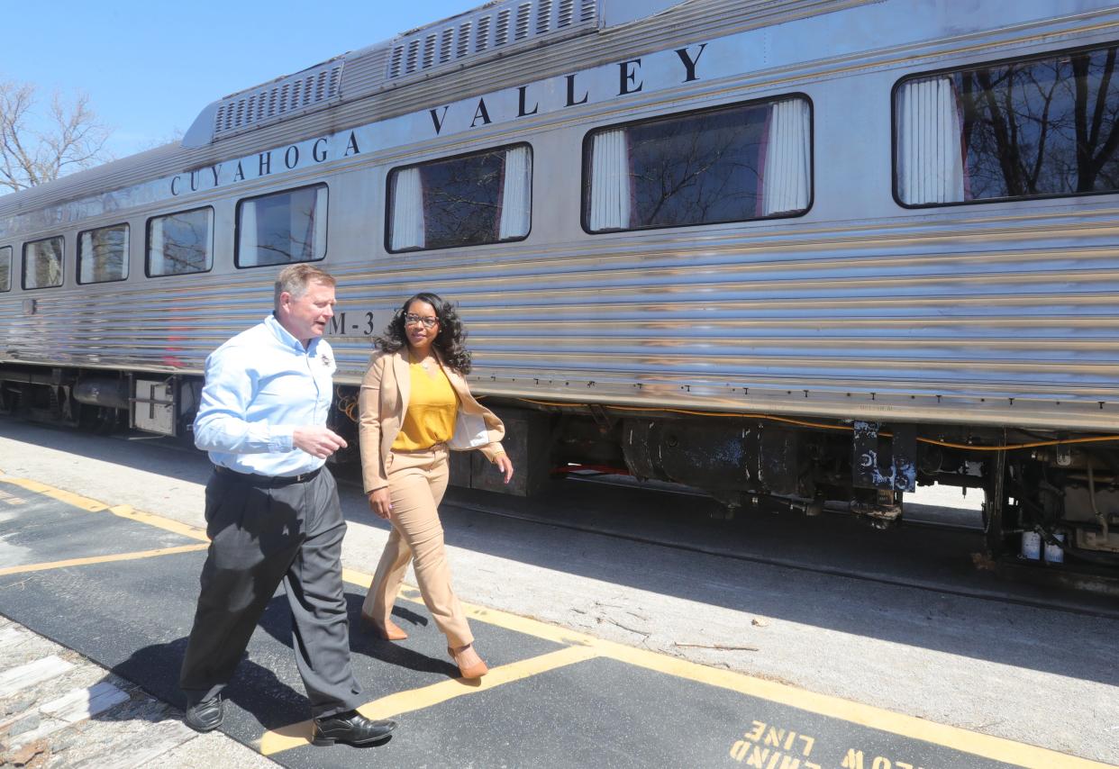 Joe Mazur, Cuyahoga Valley Scenic Railroad president and CEO, talks with U.S. Rep. Emilia Sykes on Monday in Peninsula.