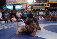 U.S. wrestler Jordan Oliver (bottom) spars with Italian wrestler Frank Chamizo at the "Beat The Streets" wrestling event in Times Square, New York City, U.S., May 17, 2017. REUTERS/Joe Penney