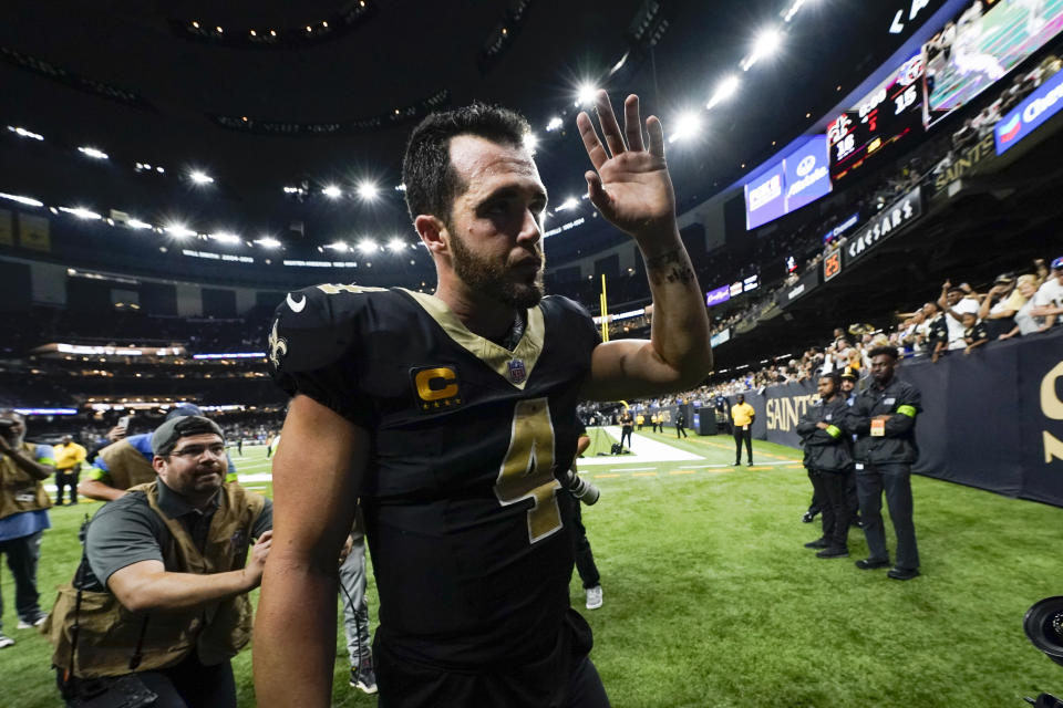 New Orleans Saints quarterback Derek Carr (4) celebrates the team's win against the Tennessee Titans after an NFL football game in New Orleans, Sunday, Sept. 10, 2023. (AP Photo/Gerald Herbert)