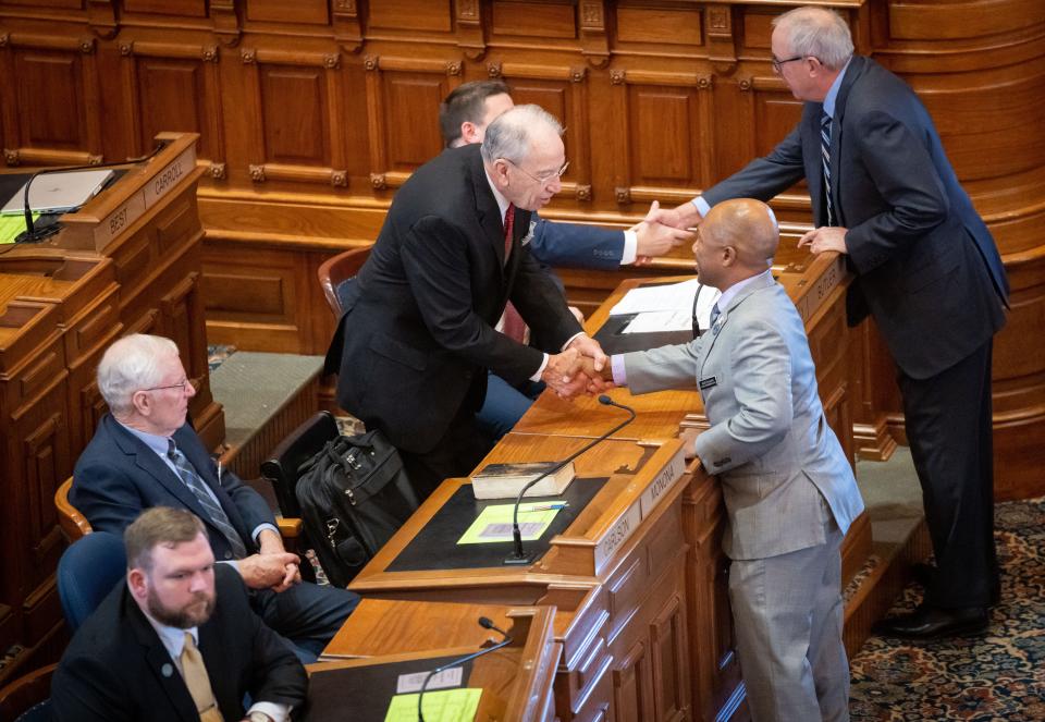 U.S. Sen. Chuck Grassley shakes hands with Rep. Ross Wilburn on the first day of the Legislative session, Monday, Jan. 9, 2023.