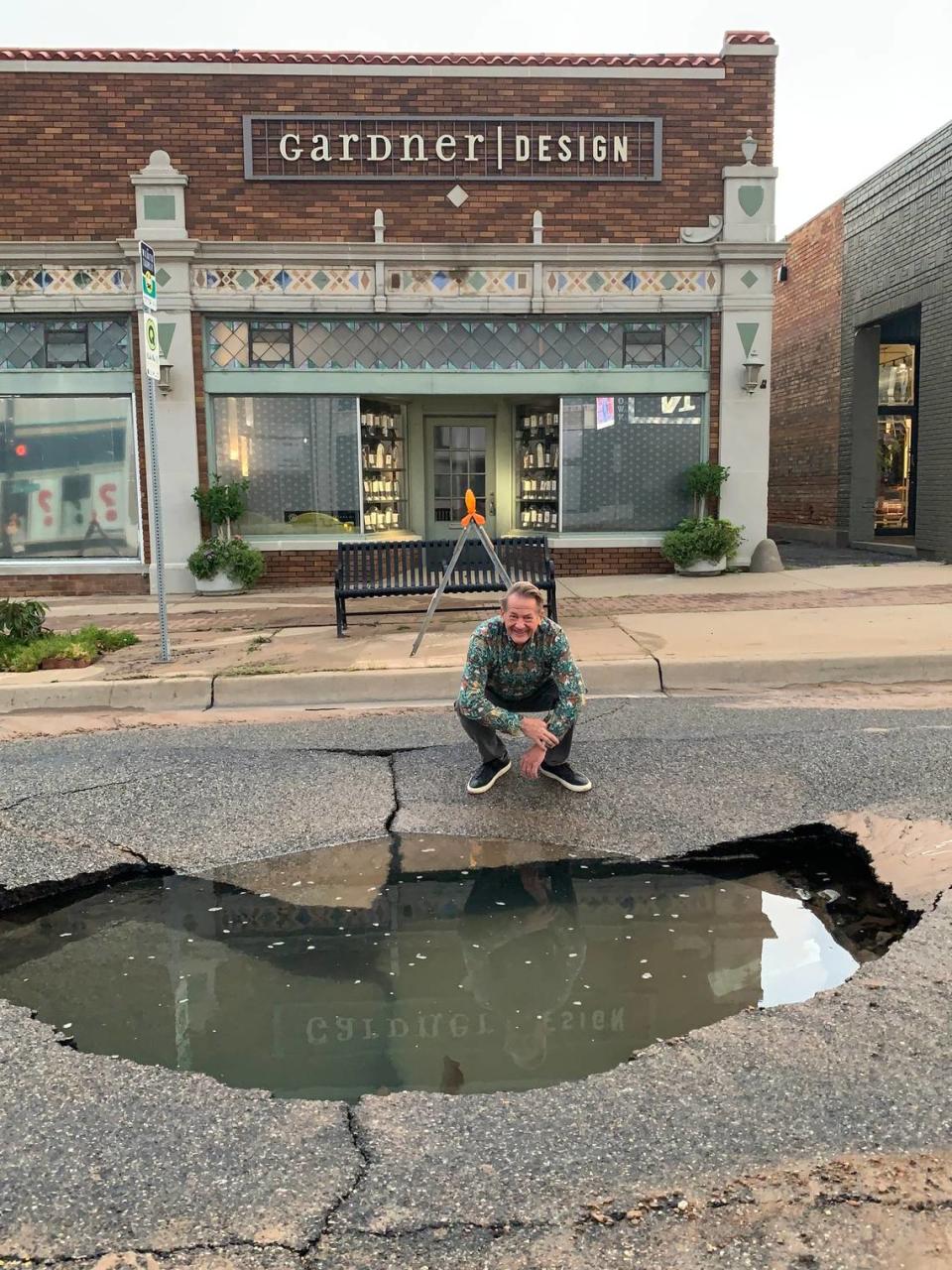 Bill Gardner discovered a large sinkhole that opened up in front of his longtime Gardner Design shop Wednesday morning.