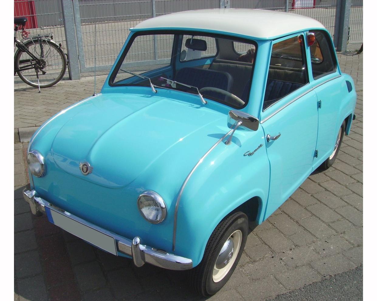 Goggomobil 250 in sky blue parked on pavement