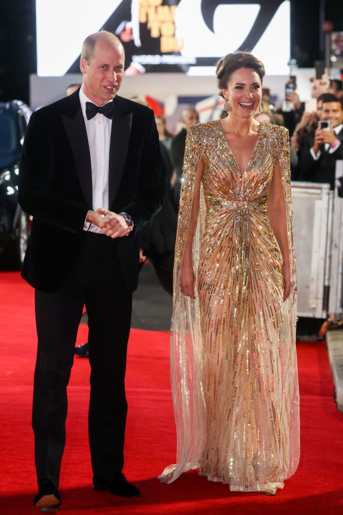 <p>Prince William wore a classic black tux and bow-tie, while Kate opted for a high-octane gold caped Jenny Packham gown.</p>