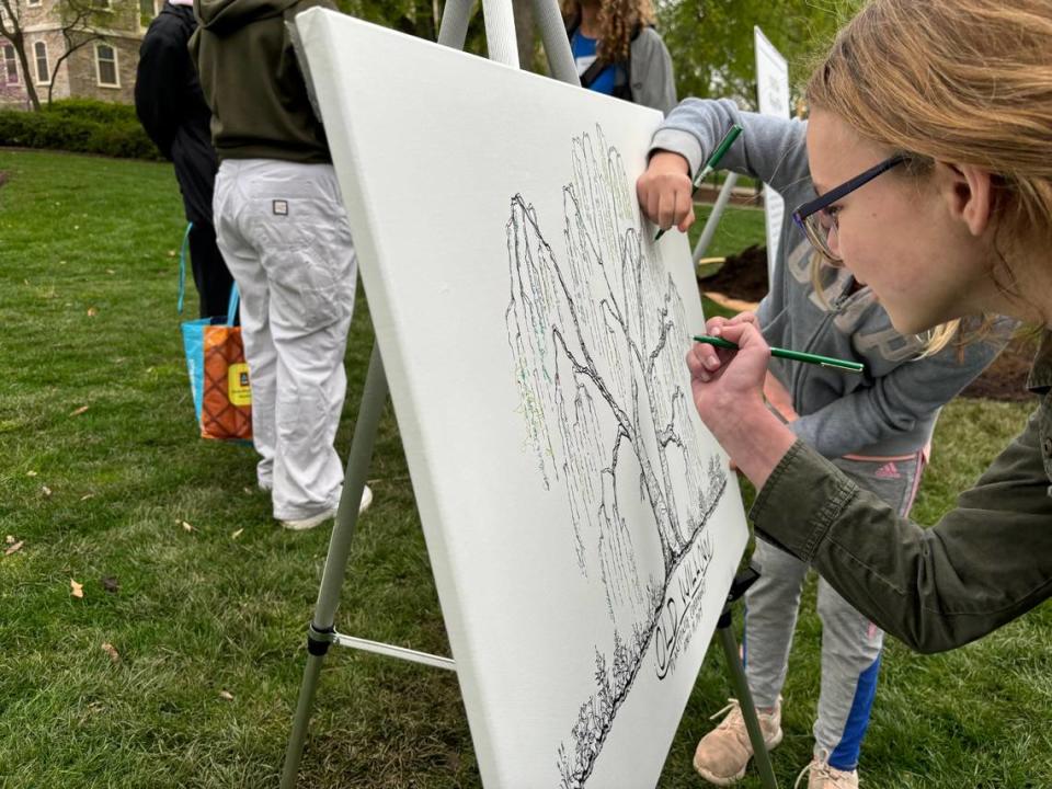 Attendees sign the drawing of the original Old Willow to commemorate the planting of the tree’s fourth generation. Keely Doll/kdoll@centredaily.com