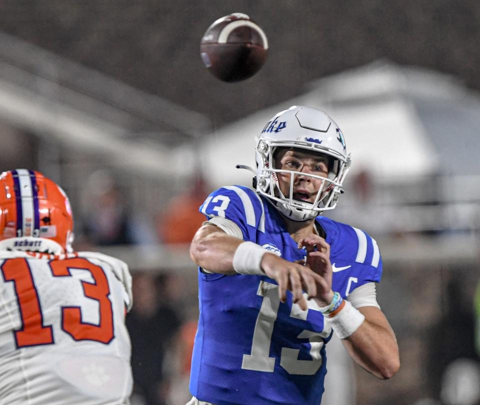 Duke University quarterback Riley Leonard (13) passed the ball against Clemson during the first quarter of the season opening game at Wallace Wade Stadium in Durham, N.C. Monday, Sept 4, 2023.