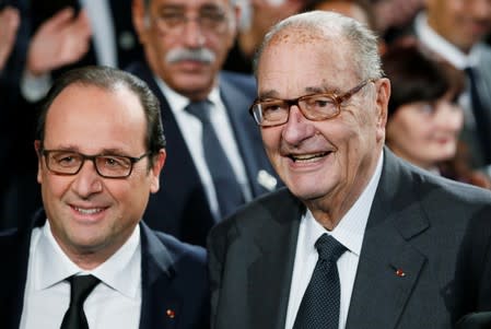 FILE PHOTO: File photo of French President Francois Hollande and former French President Jacques Chirac posing before attending the award ceremony for the Prix de la Fondation Chirac at the Quai Branly Museum in Paris