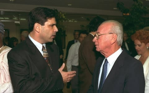 Former Israeli Prime Minister Yitzhak Rabin speaks with former energy minister Gonen Segev - Credit: REUTERS/GPO