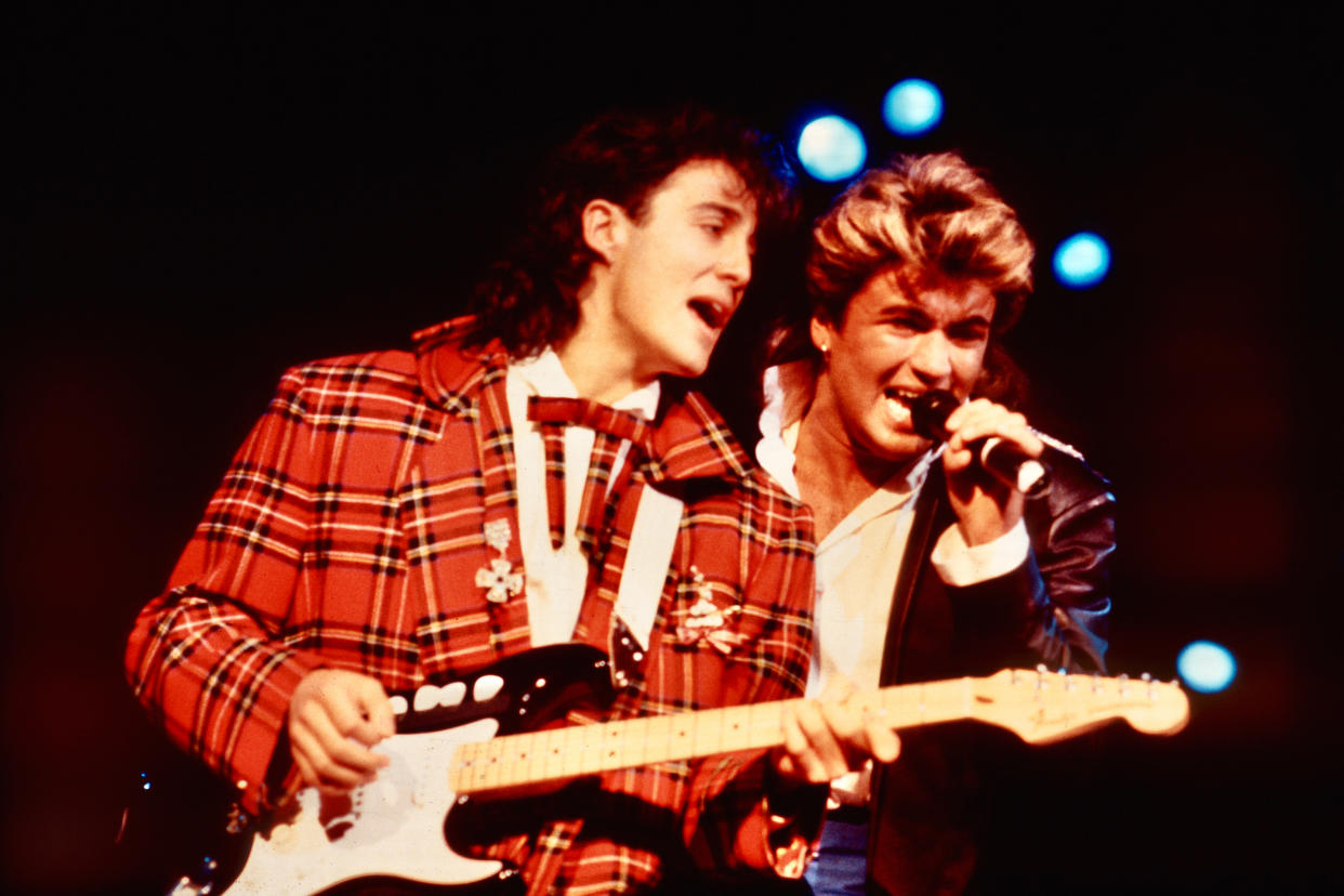 George Michael and Andrew Ridgely of Wham!, Wembley Arena 12/23/84 (Photo by Steve Rapport/Getty Images)