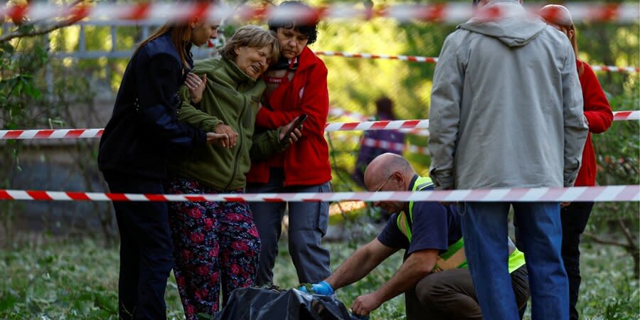 A woman near the body of her dead daughter, killed as a result of a new attack on Kyiv