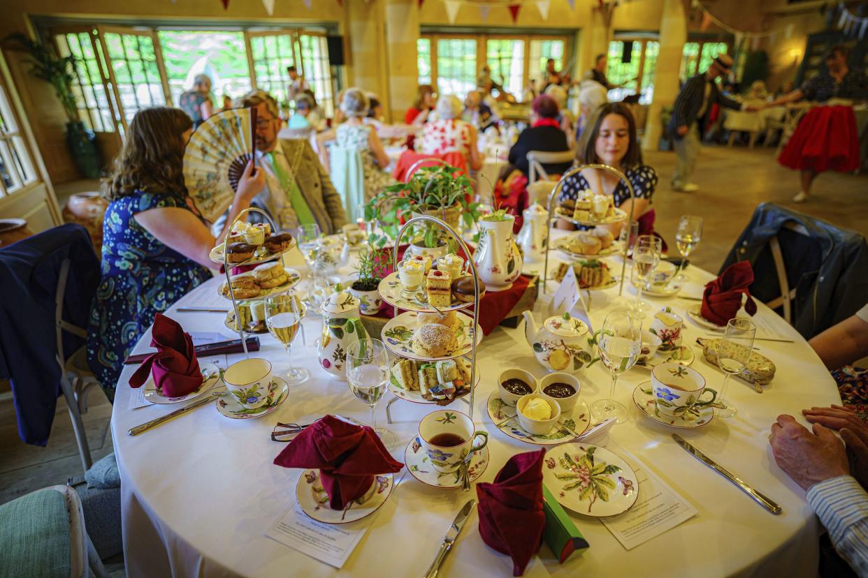 Traditional cakes and sandwiches on tiered trays are seen during a Jubilee tea dance hosted by The Prince's Foundation to mark the Platinum Jubilee at Highgrove near Tetbury, Gloucestershire, England on Tuesday, May 31, 2022. Prince Charles was joined by Jools Holland, Ruby Turner and Patrick Grant at the celebratory tea dance.