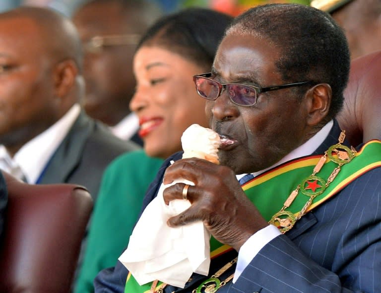 Zimbabwe's Robert Mugabe, seen here eating ice cream at his inauguration after the 2013 elections, owns the large Gushungo dairy